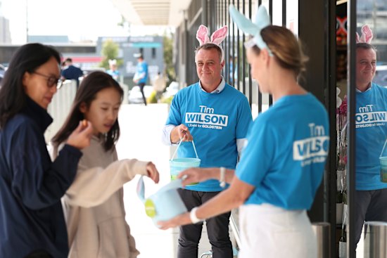 Tim Wilson hands out Easter eggs outside Woolworths in Moorabbin.