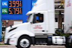  A truck drives past  a Minneapolis fuel station as diesel prices hit a record high in the US, on September 4.
