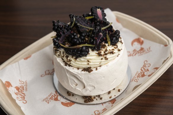 Pavlova filled with key-lime curd, toasted rice cream, vanilla chantilly, blackberry and candied lime zest with toasted wild rice crumb.