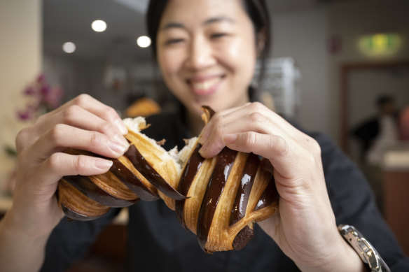 Frances Song with a chocolate croissant.
