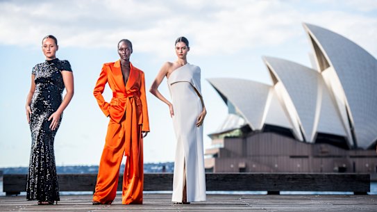 Models Cameron Stephens Miji Awakyr and Marisa Pavela in Carla Zampatti ahead of Australian Fashion Week which returns to Circular Quay, Sydney on Monday.