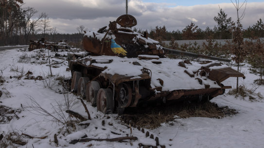 A destroyed Russian tank with an artwork on it by Italian urban artist Tvboy, near the village of Dmytrivka, outside Kyiv, Ukraine. 