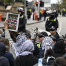 Pro-Palestine protestors were held back by police to stop them approaching a pro-Israel protest.