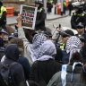 Pro-Palestine protesters were held back by police to stop them approaching a pro-Israel protest.