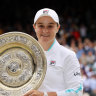 Ash Barty lifts the Venus Rosewater trophy.