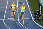 Rose Davies and Jess Hull cross the finish line in the women’s 5000m final.