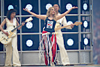 Rain be damned: Kylie Minogue rocks the ’G moments before the AFL grand final kicks off.