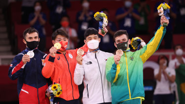 Silver medalist Vazha Margvelashvili of Team Georgia (left) is in hot water.