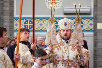 Ukrainian Bishop Mykola Bychok delivers Easter mass in North Melbourne on Sunday. 