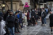 Long lines of people wanting to get vaccinated against COVID-19 at Melbourne Town Hall on Friday.