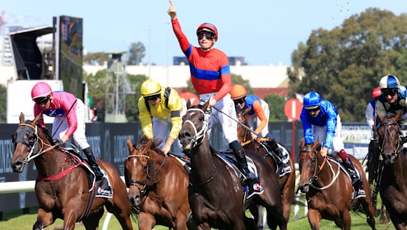 James McDonald salutes on Verry Elleegant as Addeybb and Tom Marquand (yellow silks) finish second.
