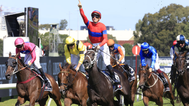 James McDonald salutes on Verry Elleegant as Addeybb and Tom Marquand (yellow silks) finish second.