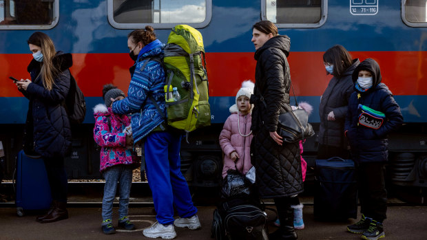 Hundreds of people arrive to Hungarian train station after crossing the border at Zahony-Csap as they flee Ukraine.