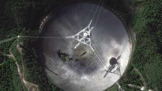 The damaged radio telescope at the Arecibo Observatory in Puerto Rico.
