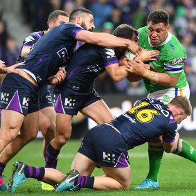 Josh Papalii appears to take on the entire Storm team in the qualifying final.