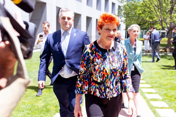 Senator Pauline Hanson with Senator Sean Bell after being expelled from the Senate for seven days after she wore a burqa in the chamber.