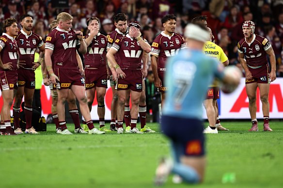 Maroons players look upset after conceding a try in the third match of the Men's State of Origin series between the Queensland Maroons and New South Wales Blues at Suncorp Stadium.