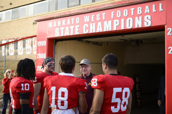 Tim Walz speaks to players on the Mankato West football team.