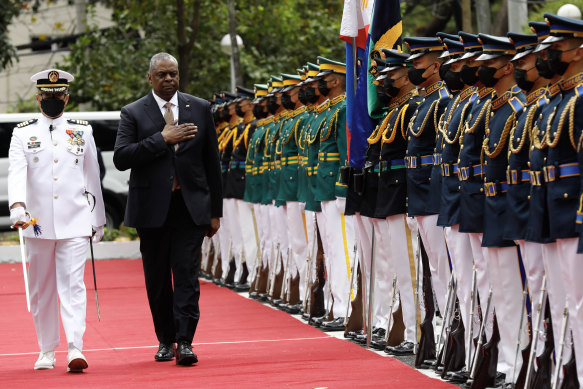 United States Defence Secretary Lloyd Austin walks past military guards during arrival honours at the Department of National Defence in Camp Aguinaldo.