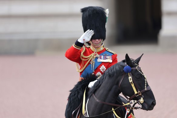 King Charles III salutes during Trooping the Colour, a traditional parade held to mark the British Sovereign’s official birthday. 