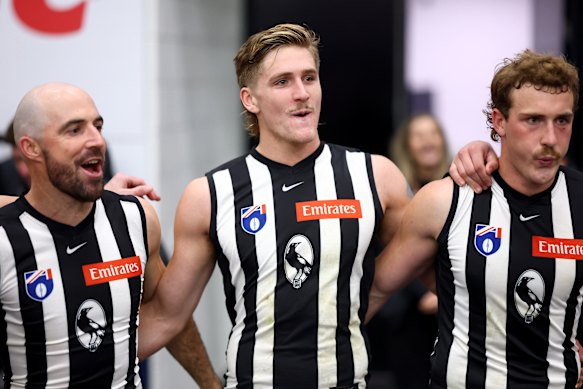 Steele Sidebottom, Ed Allan and Angus Anderson sing the song after Collingwood’s win over Carlton last month.