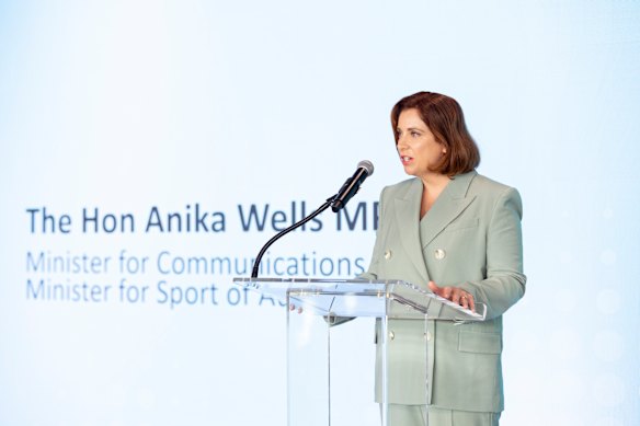 Communications and Sport Minister Anika Wells speaking in New York last September, before her very quiet summer.