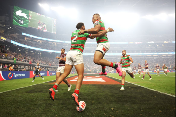 Alex Johnston and Richard Kennar celebrate during their clash with the Roosters in Vegas.