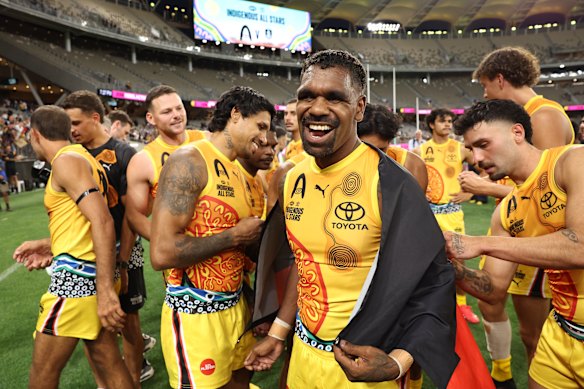 Liam Ryan celebrates victory over Fremantle in the  Indigenous All Stars match at Optus Stadium.