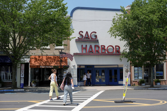 People walk along Main Street in Sag Harbor on Tuesday.