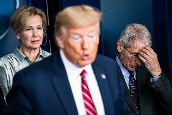 White House coronavirus response co-ordinator Dr Deborah Birx and Fauci listen to Trump’s coronavirus briefing on March 20, 2020. 