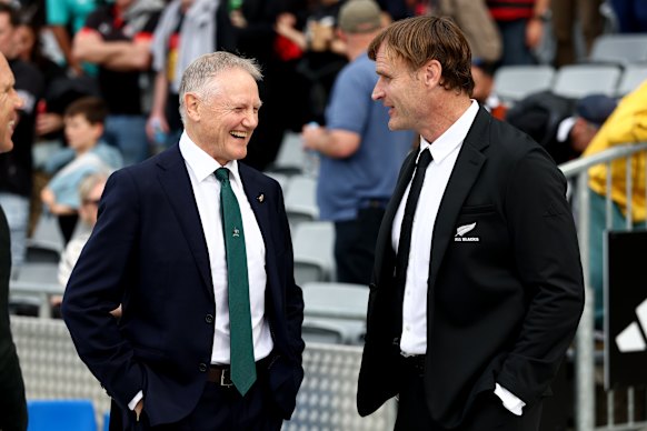Joe Schmidt talks with coach Scott Robertson in September.
