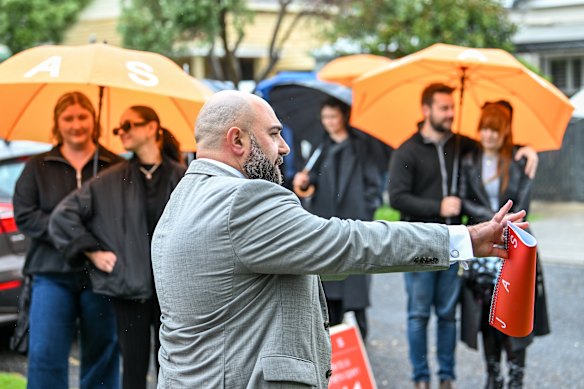 Auctioneer John Galea selling the Footscray home.