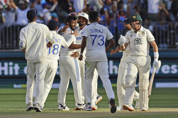 Jasprit Bumrah and India celebrate the wicket of Marnus Labuschagne.
