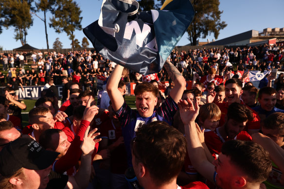 Sydney United 58 goalkeeper Danijel Nizic celebrates with fans after their semi-final win over Brisbane Roar.