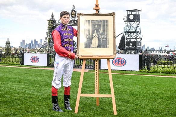 Jockey Craig Williams wears the Queen’s colours to mark the occasion at Flemington Racecourse. 