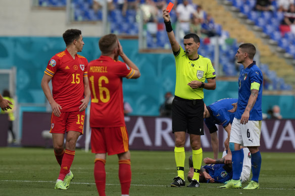 Wales’ Ethan Ampadu sees red against Italy.