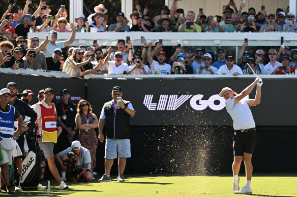 Cameron Smith tees off in front of a raucous crowd on the party hole on Saturday.