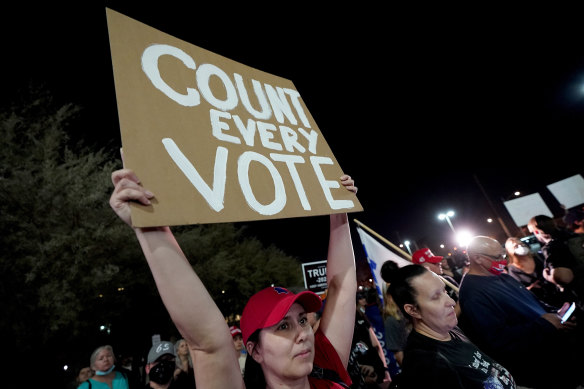 President Donald Trump supporters rally outside the Maricopa County Recorders Office in Phoenix.