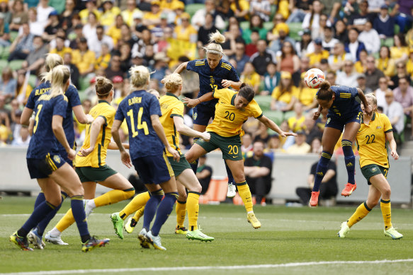 Madelen Janogy of Sweden attempts to head the ball through for a goal. 