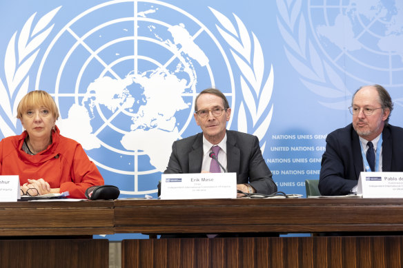 Erik Mose, centre, Chair of the Commission of Inquiry on Ukraine, Jasminka Dzumhur, left, and Pablo de Greiff, right, Commissioners of Inquiry on Ukraine, talk to the media in Geneva.