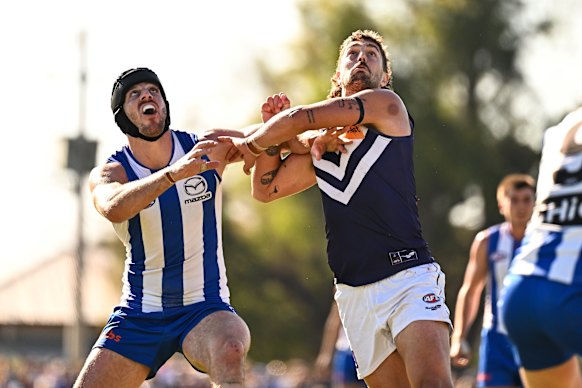 Tristan Xerri competes in a ruck contest with Luke Jackson.