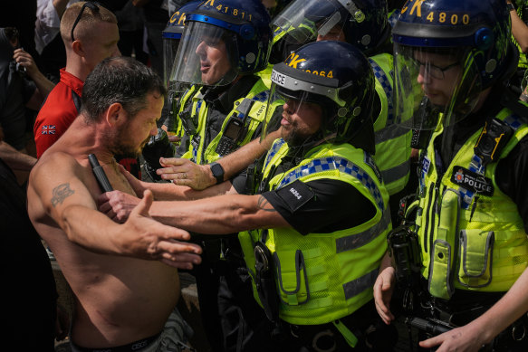 UK police clash with right-wing protesters in Manchester.