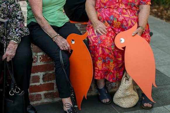 Locals held cardboard cockatoos in tribute to Haines. 