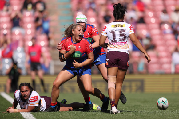 Knights prop Caitlan Johnston celebrates her try.