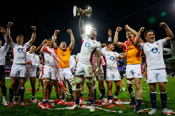 Courtney Lawes and England players celebrate their 2-1 series victory over the Wallabies at the SCG on Saturday night.