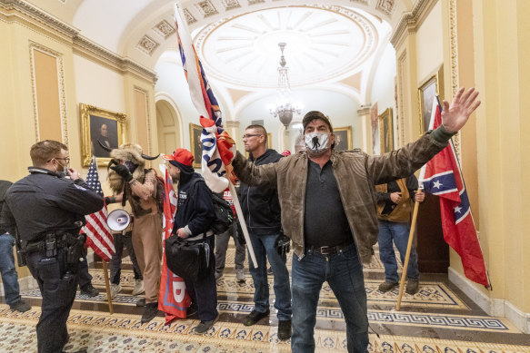 Supporters of President Donald Trump are confronted by US Capitol Police officers. 