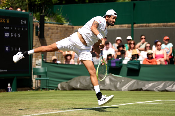 Matteo Berrettini serves against Alex De Minaur in the men’s singles second round match.