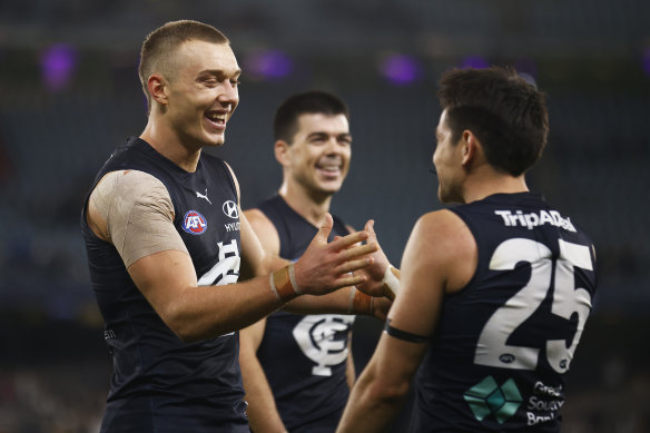 Patrick Cripps (left) led the Blues’ midfield on Saturday night.