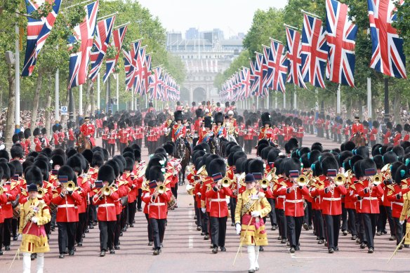 The royal family parades on horseback, centre, during Trooping the Colour last year.