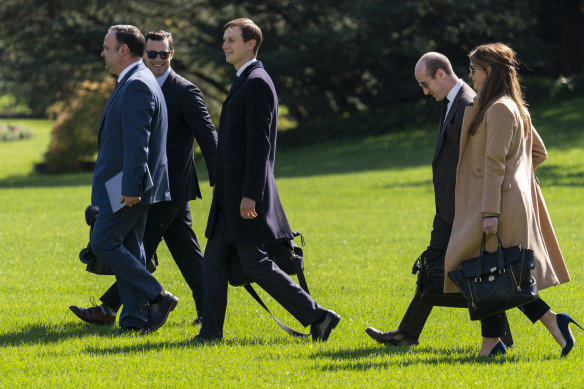 Hope Hicks, right, walks to board Marine One on Wednesday with other senior White House officials. Hicks tested positive for COVID-19 before Trump and first lady Melania.